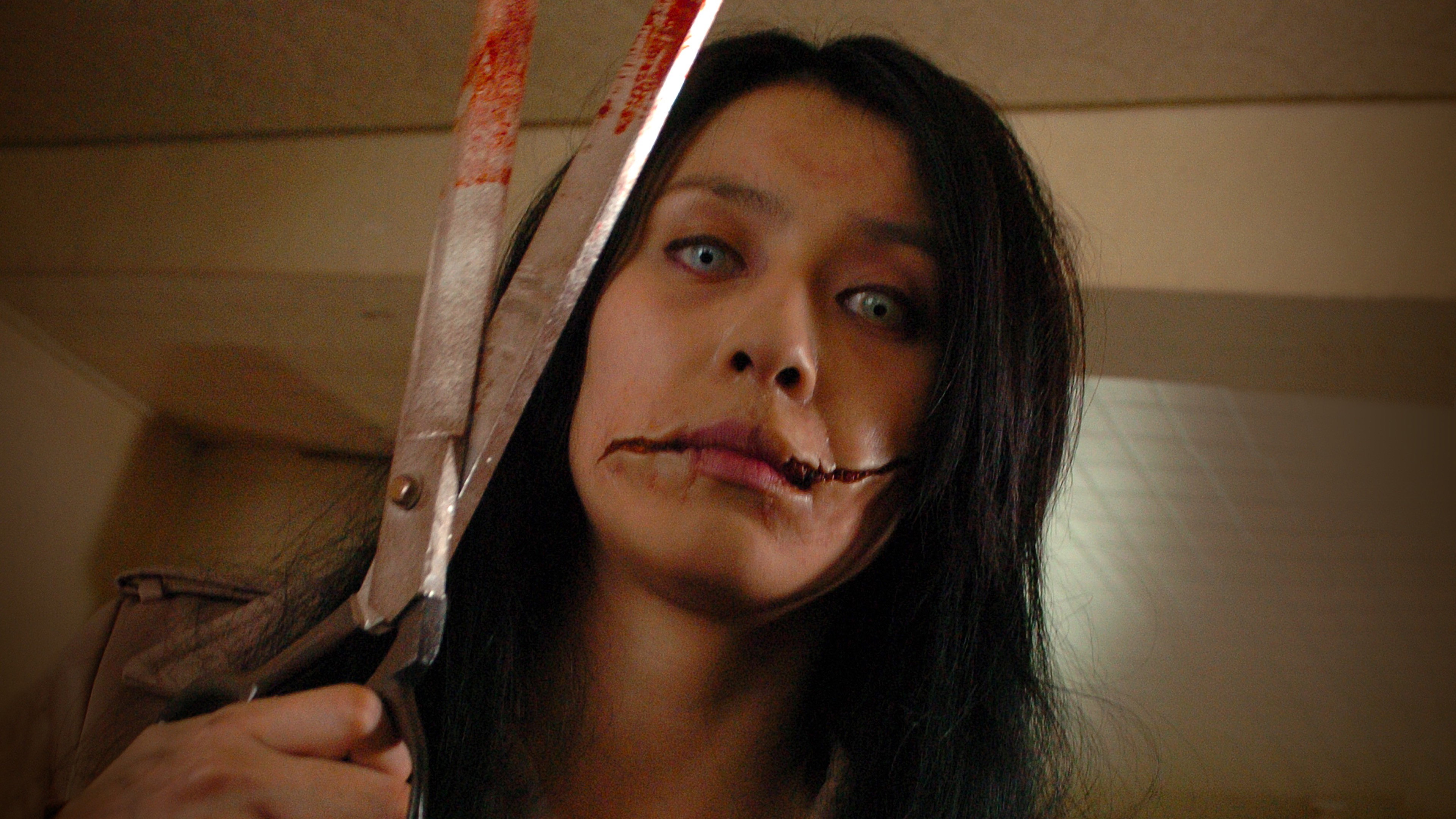 Carved: The Slit-Mouthed Woman